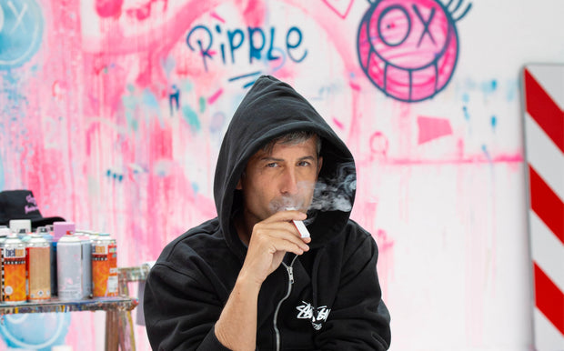 Andre Saraiva puffing ripple AMOUR in his studio on Paris 