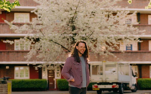Thomas Delaney in front of a blossoming tree 