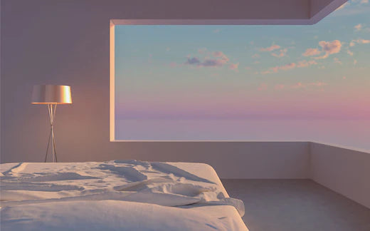Bedroom with a view of a vast sunset landscape 